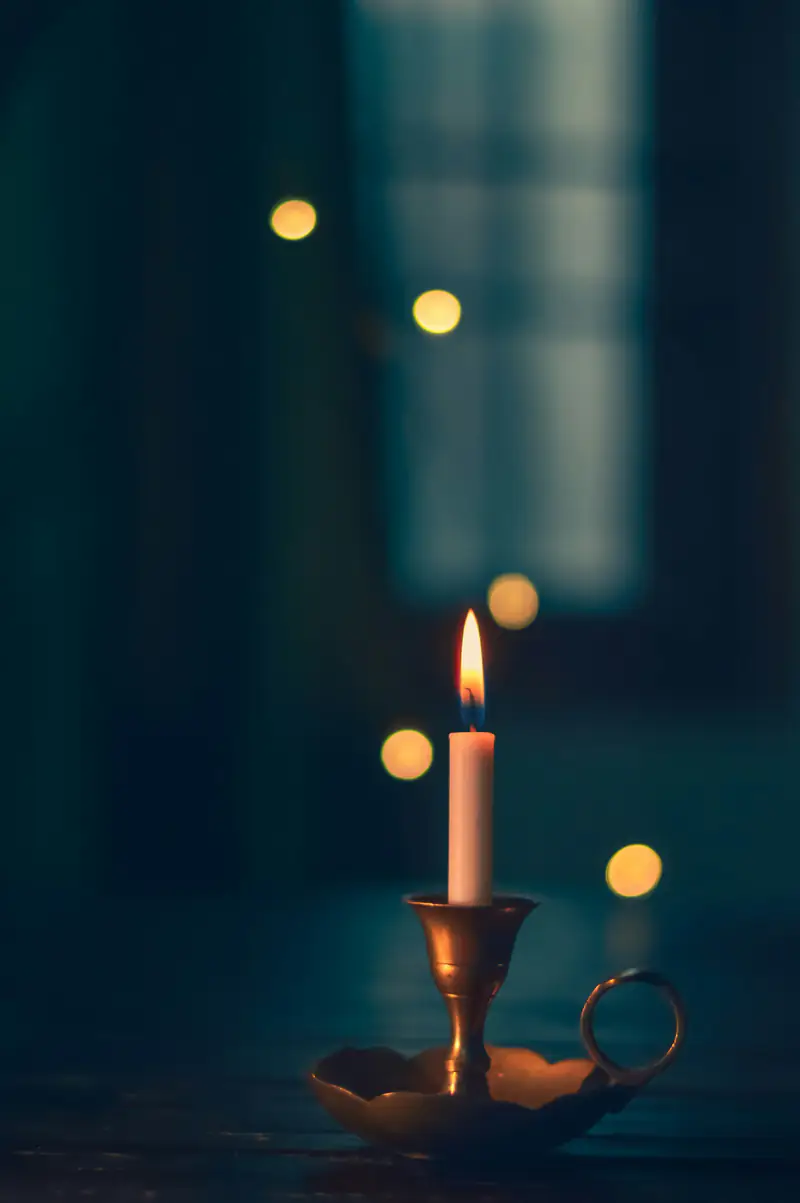 A single lit candle in a quiet room, representing bereavement and grief support in Wallsend, Newcastle upon Tyne