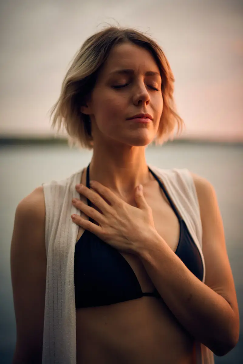 EFT tapping in Wallsend, Newcastle A woman with her eyes closed and a hand on her chest, illustrating EFT tapping in Wallsend, Newcastle upon Tyne