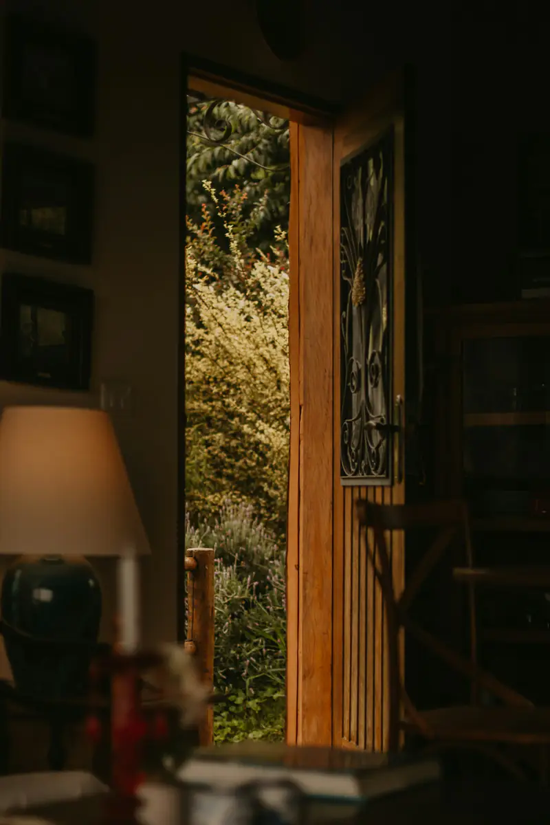 Phobia hypnotherapy in Wallsend, Newcastle An open door leading out to green trees, representing overcoming phobias in Wallsend, Newcastle upon Tyne