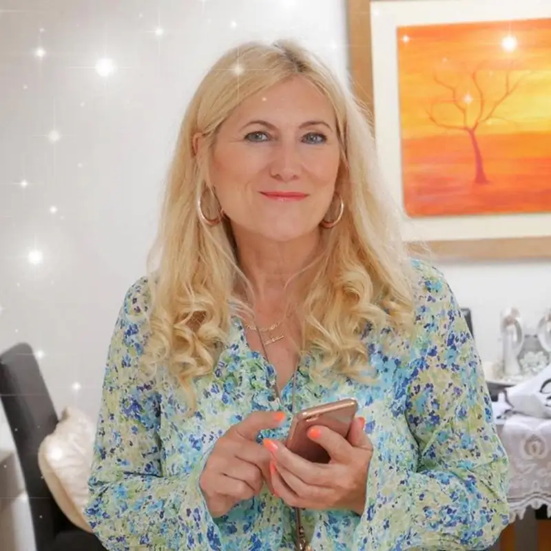 Sonya Hudson, clinical hypnotherapist, smiling in her therapy room in Wallsend, Newcastle upon Tyne